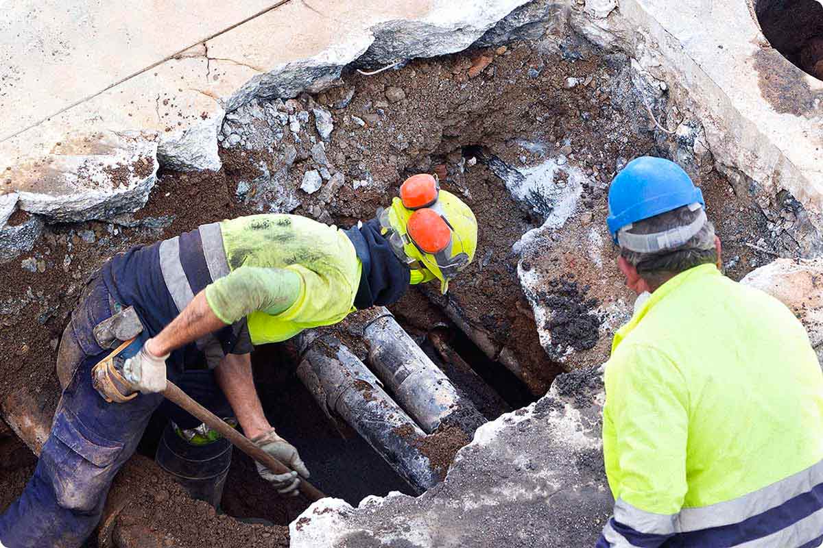 Construction workers working on utilities on utility project